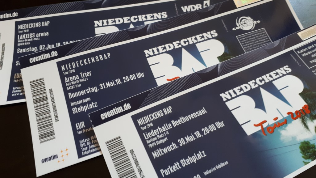 Drei Eintrittskarten für die "Niedeckens BAP Tour 2018". Die Karten zeigen verschiedene Veranstaltungsorte und Termine: LANXESS Arena, Köln (Samstag, 02. Juni 2018) / Arena Trier (Donnerstag, 31. Mai 2018) / Liederhalle Beethovensaal, Stuttgart (Mittwoch, 30. Mai 2018)